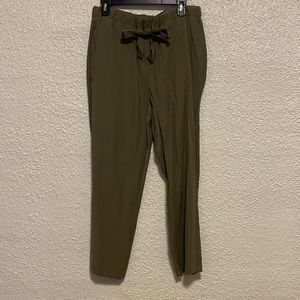 Olive green casual pants with a belt tie.